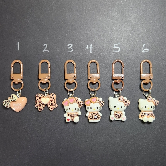 Hello Kitty Charms with Pink Leopard Accents PRICE IS FOR ONE BUNDLE AND SAVE - Picture 1 of 8